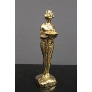 Art Deco Sculpture In Golden Regulates Representing A Woman Around 1930