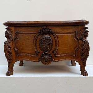 Chest, Curved And Carved Box In Walnut. 