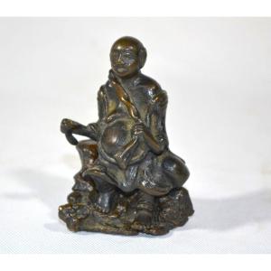 Budai Sitting On A Rock.bronze. China Qing Dynasty Or Before.