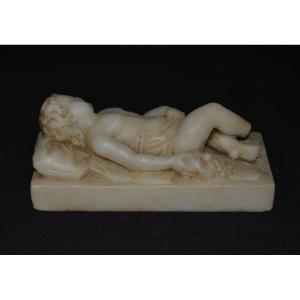 Sleeping Putti Holding A Silenus Mask, Carved In Alabaster. Europe 19th Century.