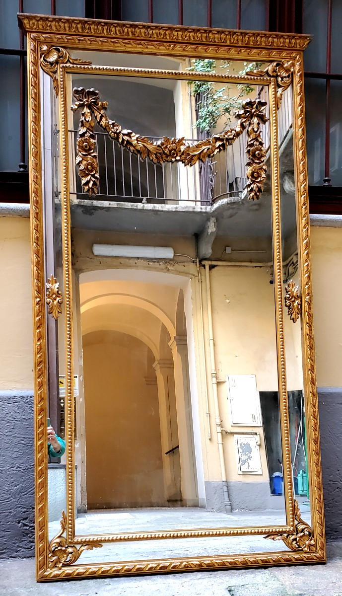 Specchiera dorata oro 18kt  stile Luigi XVI ,scolpita a mano su legno ,di manifattura Italiana 