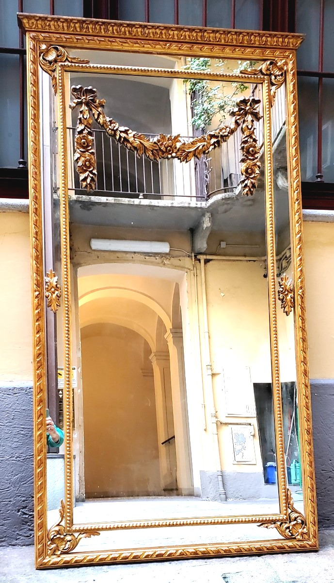 Specchiera dorata oro 18kt  stile Luigi XVI ,scolpita a mano su legno ,di manifattura Italiana 