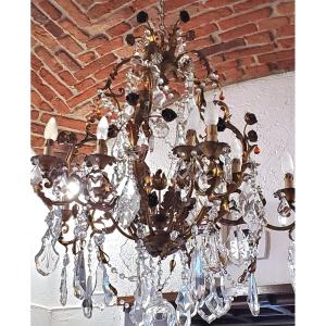 Lampadario in ferro battuto , e decorazioni foglie e fiori in lamierino 