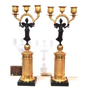 Due antichi candelieri a 3 fiamme  in bronzo dorato 18kt 