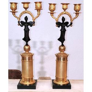 Due antichi candelieri a 3 fiamme in bronzo dorato 18kt