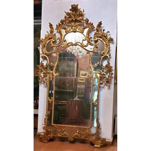  Grande Specchiera Luigi xv ,in legno scolpito e dorata in oro zecchino 18 kt . 