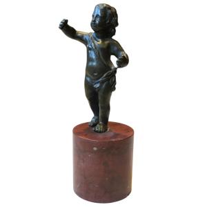 Small Bronze Statuette Of A Child On A Red Marble Base