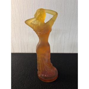 Woman Styling Her Hair With Daum Crystal