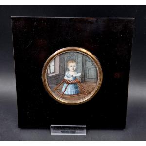 Miniature Child Playing In Their Walker Or Baby Walker Indoors