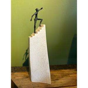 Contemporary Sculpture Of A Man Climbing Stairs