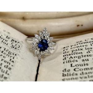 Marquise Ring In White Gold, Oval Sapphire Of 1.20 Carats And Marquise-cut Diamonds Totaling 1 Carat