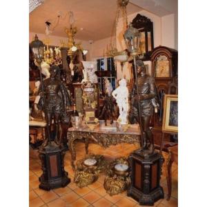 A Pair Of Squires Carved In Wood