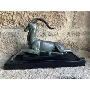 Art Deco Statue Of A Reclining Antelope. Signed Fayral, Pseudonym Of Pierre Le Faguays