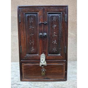 Zitan Cabinet With A Shiwan Pot, 19th Century China