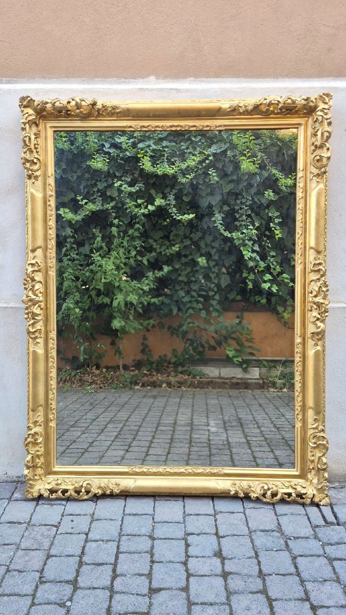 Specchiera antica emiliana traforata in legno dorato, di metà '800.