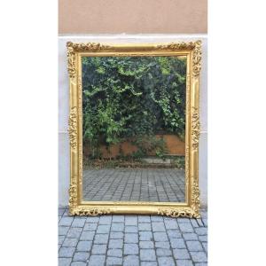 Specchiera antica emiliana traforata in legno dorato, di metà '800.