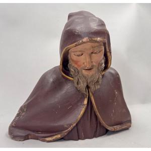 Wood Carving Of A Bust Of A Monk In Robes