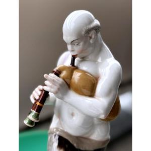 Kpm Berlin. Arab With Bagpipes From The Wedding Procession. Porcelain Figure After A 1905 Model.