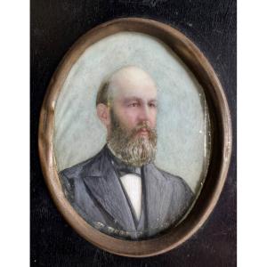 Oval Shaped Painted Miniature Portrait Representing A Bearded Man In A Black Jacket.