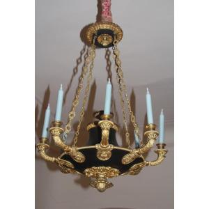 Lustre à l'antique en bronze doré et patiné, époque Louis-Philippe, 1830-1840.