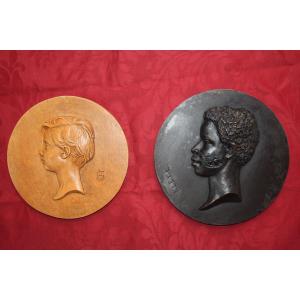 Medallions, Profile Portrait Of A Child In Patinated Plaster, One Signed L.kley (1833-1911), 19th Century.