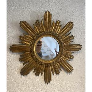 A Sunburst Mirror In Gilded Wood