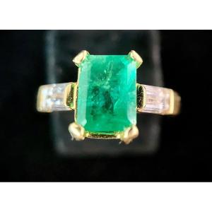 Yellow Gold Ring Set With A 1.25 Carat Emerald And Two Baguette Cut Diamonds 0.70 Ct