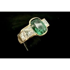 Yellow Gold Ring Set With A 1.50 Carat Emerald And 1.75 Carats Of Princess-cut Diamonds