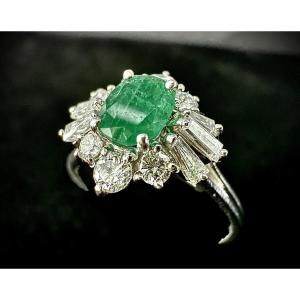 White Gold Ring Set With A 0.70 Carat Oval-cut Emerald Surrounded By Diamonds
