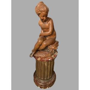Young Girl Sitting On A Rock Holding A Bow In Terracotta 18th Century 