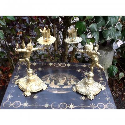 Pair Candlesticks With Cherubs In Bronze