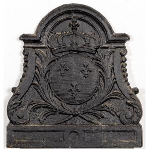 A Fireplace Plate With The Coat Of Arms Of France