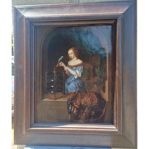 Hst Woman Feeding A Parrot Flemish School Of Aptres Jacob Ochtervelt