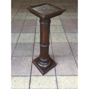 A Natural Wood Saddle Or Column