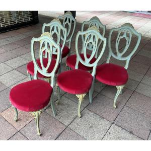 Six Chairs In Painted And Gilded Wood.