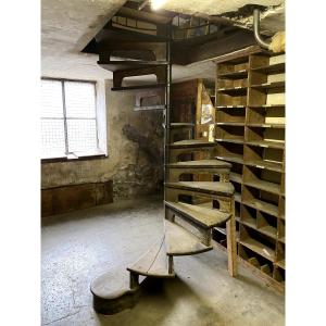 Spiral Staircase Made Of Iron And Wood With Openwork Risers 