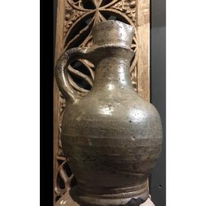 A Stoneware Jug Dating From The Late Middle Ages.