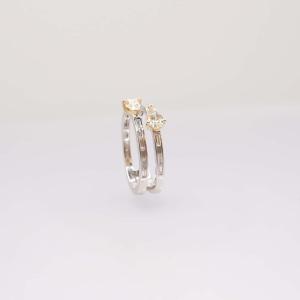 Ring Adorned With Pear-shaped Daffodil Diamonds And Baguette Diamonds