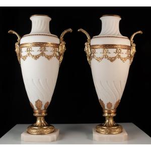 Pair Of Biscuit Porcelain Vases With Bronze Mounts