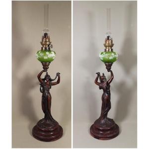 Signed Art Nouveau Oil Lamp, Sculpture Of A Woman With Flowers, And Enameled Reservoir With Faces.
