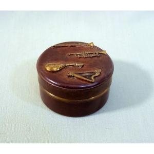 Old Circular Copper Dinanderie Rosin Box With Applied Musical Instrument Decoration