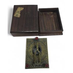 A 19th-century Asian Portable Bronze Sundial Adorned With Semi-precious Stones.