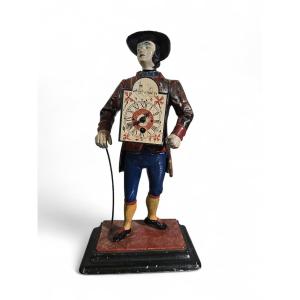 A 19th-century Figurative Mantel Clock Depicting A Clock Salesman