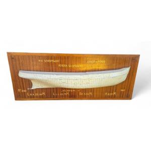 1957 Model Boat On A Wooden Panel