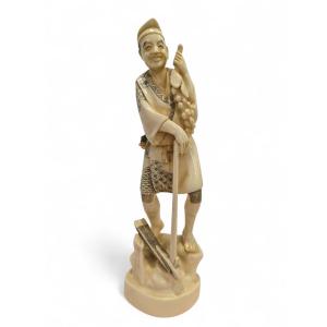 19th-century Japanese Bone Sculpture Depicting A Grape Seller, Signed
