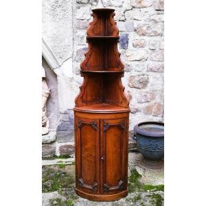 A Corner Cabinet With Shelf