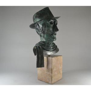 Bronze Bust Of A Man With Hat And Scarf.