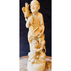 Ivory Okimono Representing A Cormorant Fisherman And A Child Meiji Period (1868-1912)