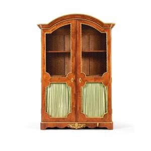 A French Regence Gilt-bronze Mounted Tulipwood Venereed Cupboard , Circa 1725.
