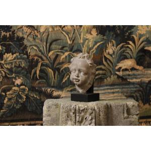 Sculpture In Gray Sandstone Representing The Face Of A Child, Netherlands, Early 18th Century.